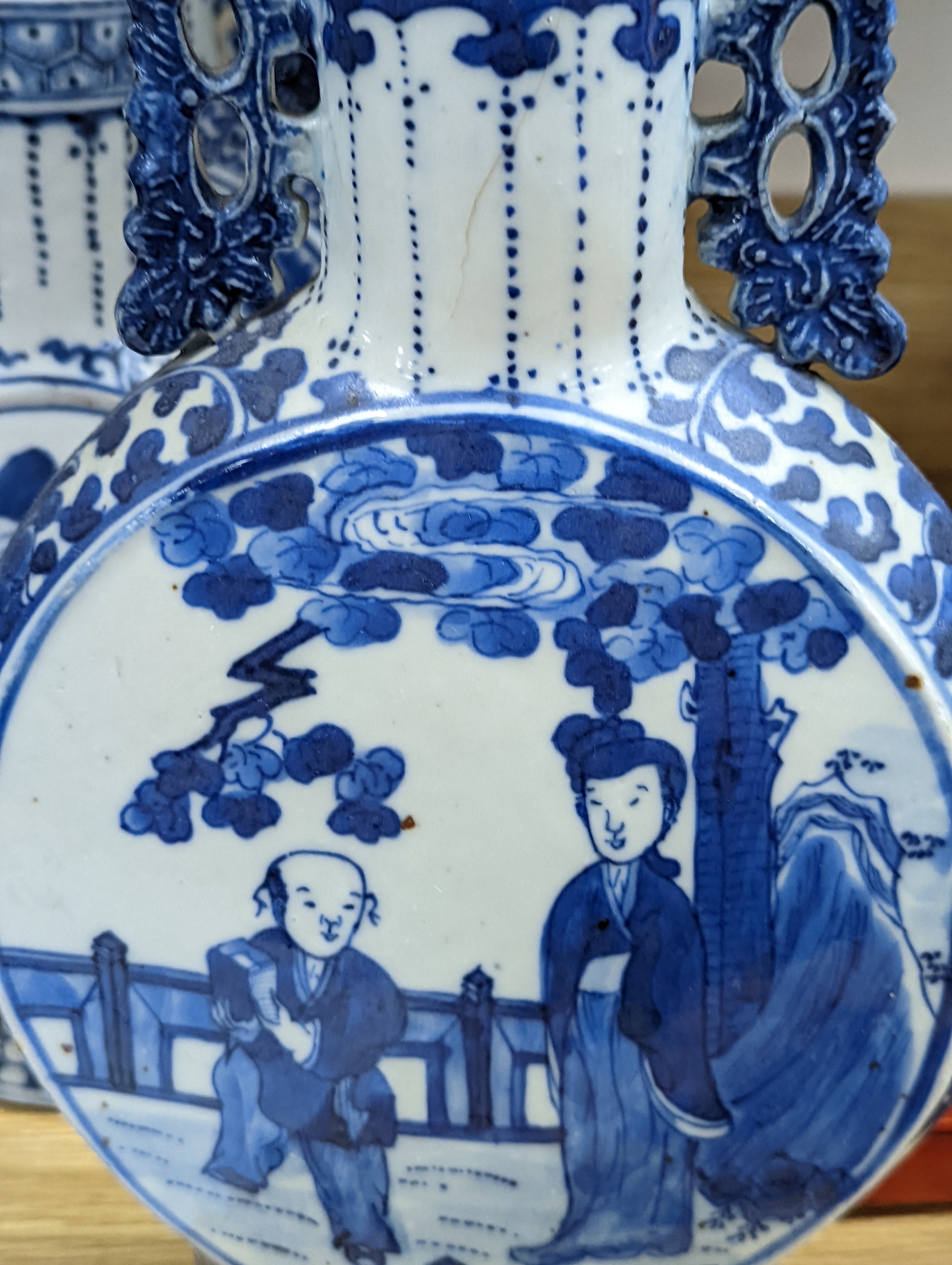 Three 19th century Chinese blue and white Moon flasks, tallest 31 cms.